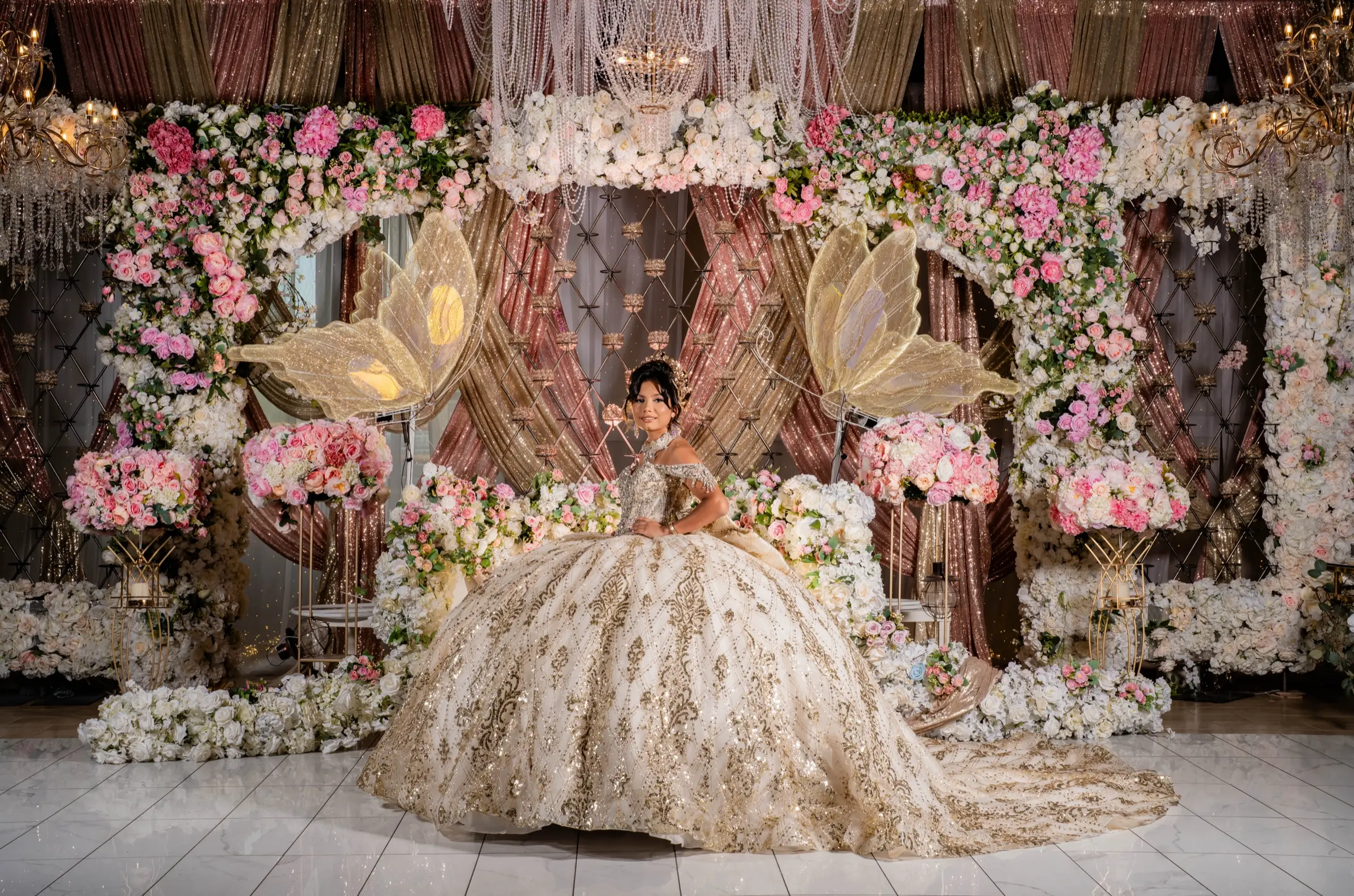 Quinceañera in a champagne gown with butterfly decor